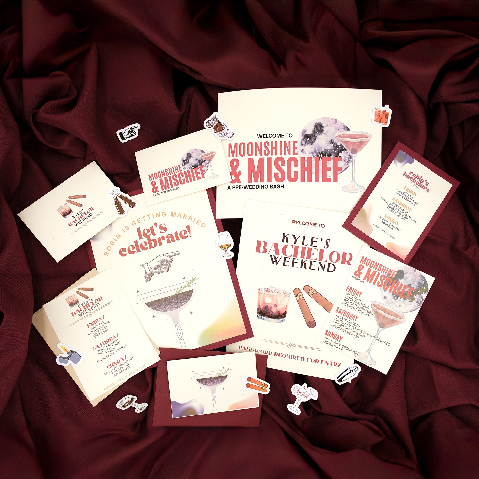 Collection of themed party invitations on a maroon fabric background